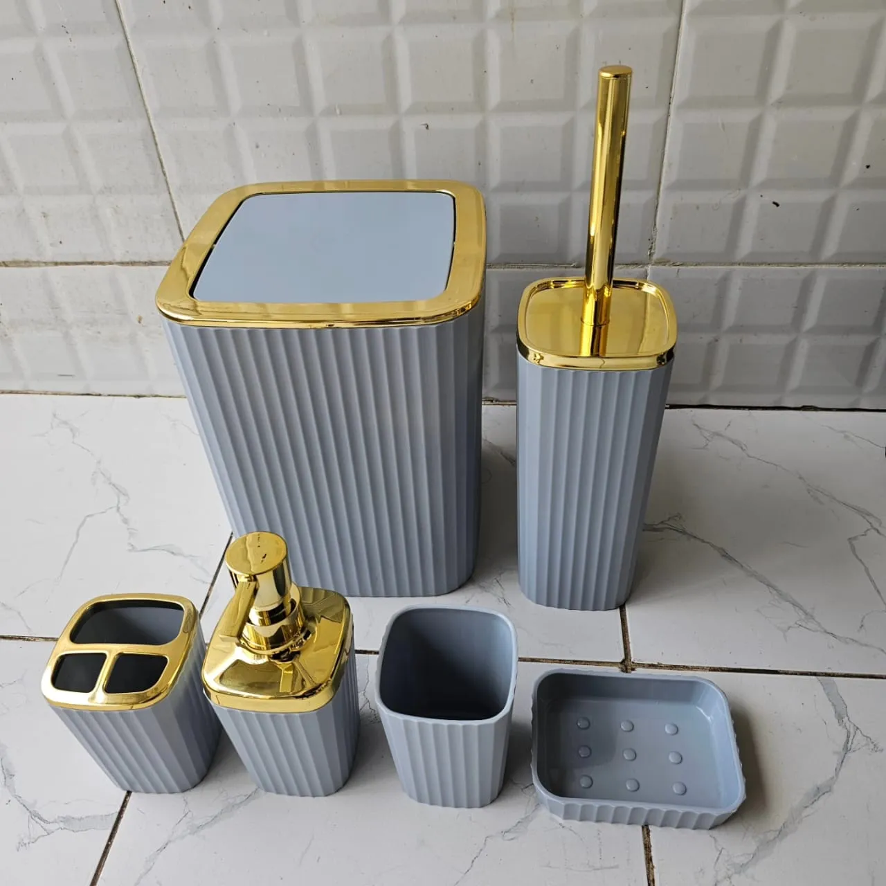 6 in 1 bathroom accessories set with gold ring.