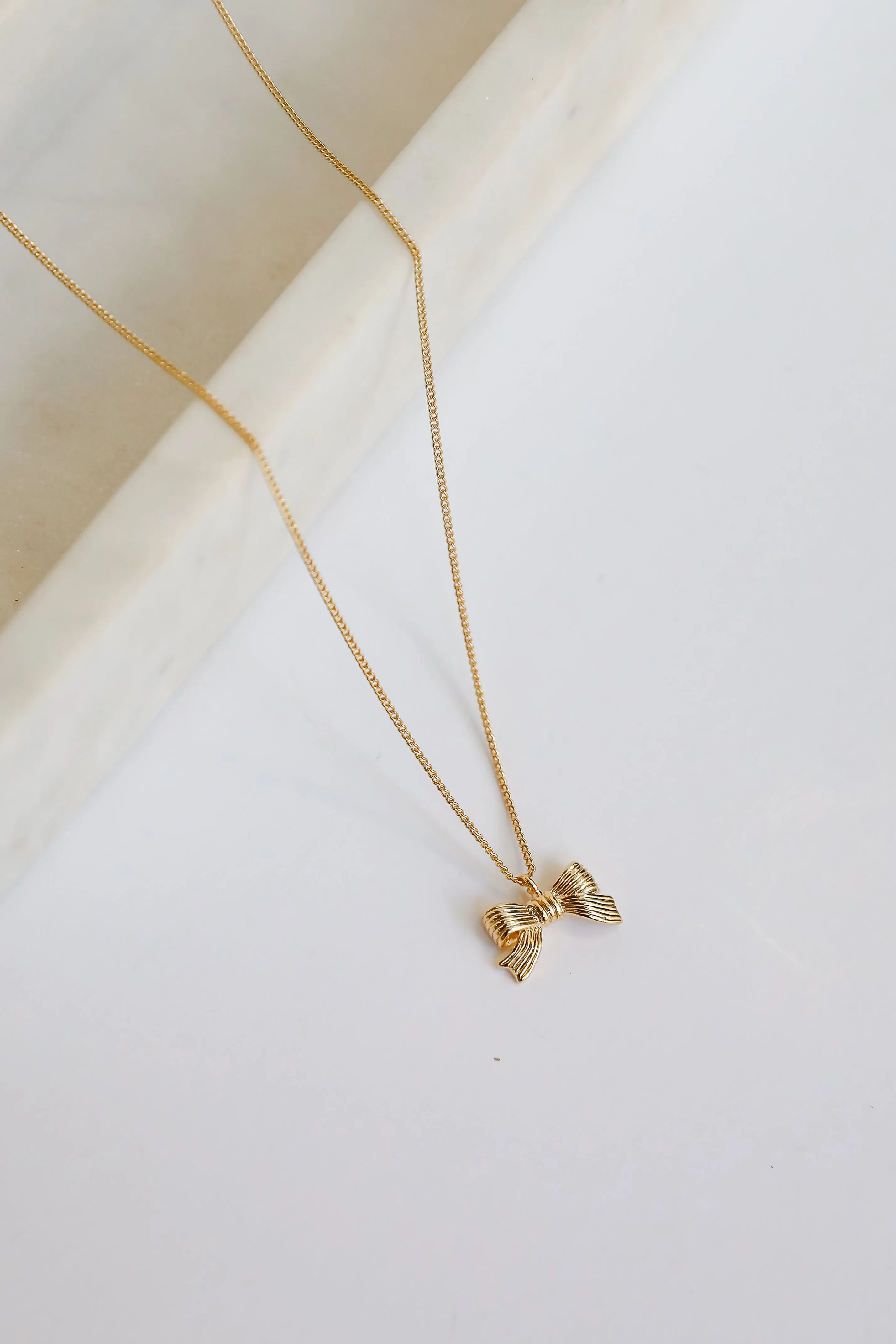 Gemma Gold Bow Charm Necklace